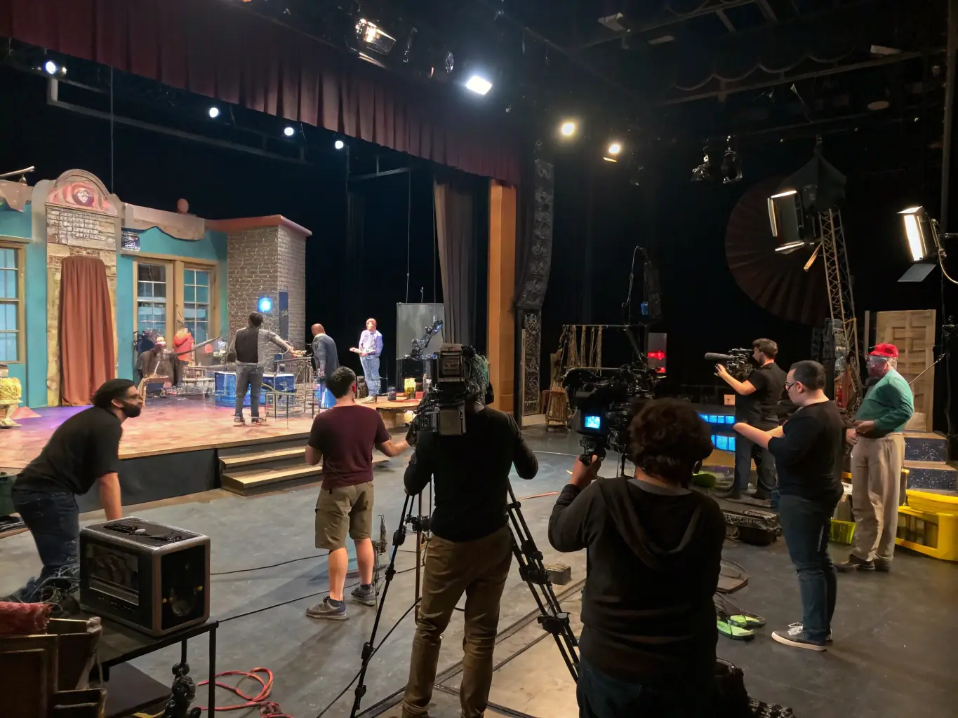 A dynamic image of artists collaborating backstage during a SPECTACLES EN RECOMMANDE-supported event, highlighting the strengthened artistic networks and collaborative opportunities.